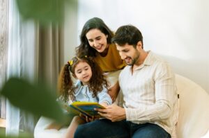 A family reading a book together